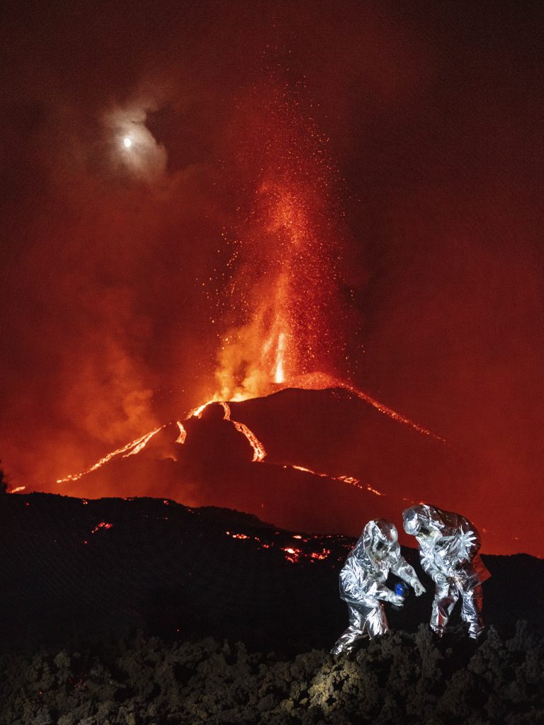 Seargent Armando Salazar and corporal Alvaro Heredia from GIETMA-UME (Environmental and tech emergency group from Military Emergency Unit) during a walk over lava slugs to measure the temperature of lava flows and take samples to help IGME-CSIC (Geological and Mining Institute of Spain from Spanish National Research Council).

The last event marks the first time this volcano has erupted since 1971.The island of La Palma is part of the Spanish Canary Islands and is one of the most volcanically active zones in the archipelago with a population of about 85,000 people. The latest eruption was preceded by several earthquake swarms. More than 7000 villagers have been evacuated and more than thousand homes have been destroyed.